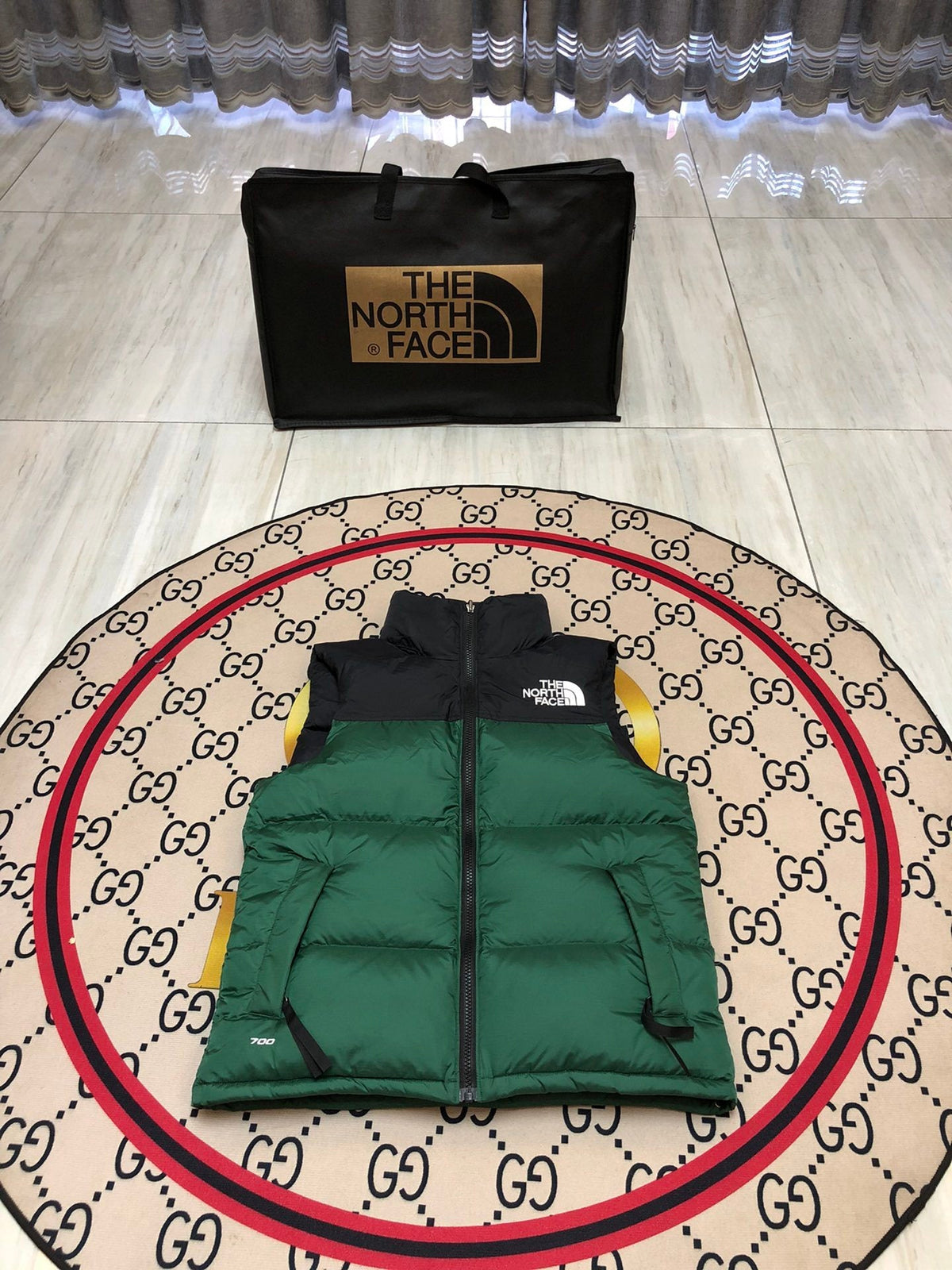 The North Face Puffer Vest in Green and Black with Stand Collar